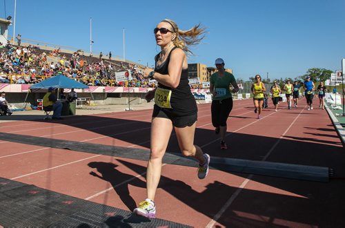 Participants in the Manitoba Marathon approach the finish line inside the University of Manitoba stadium Sunday morning. 150621 - Sunday, June 21, 2015 -  MIKE DEAL / WINNIPEG FREE PRESS