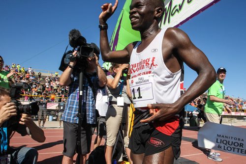 Thomas Omwenga from Kenya finishes first (2:34:17) in the men's full Manitoba Marathon Sunday morning. 150621 - Sunday, June 21, 2015 -  MIKE DEAL / WINNIPEG FREE PRESS