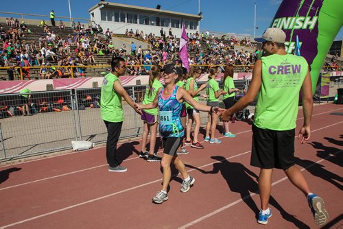 Participants in the Manitoba Marathon approach the finish line inside the University of Manitoba stadium Sunday morning. 150621 - Sunday, June 21, 2015 -  MIKE DEAL / WINNIPEG FREE PRESS