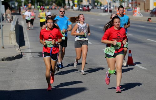On Portage Avenue crossing over Route 90, participants in the Manitoba Marathon, Sunday, June 21, 2015. (TREVOR HAGAN/WINNIPEG FREE PRESS)