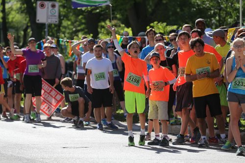 Relay checkpoint and halfway mark in Wolseley at Ruby Street. Participants in the Manitoba Marathon, Sunday, June 21, 2015. (TREVOR HAGAN/WINNIPEG FREE PRESS)