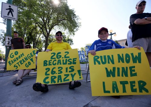 Debbie Margolis, Ron Margolis, and Andrew Brant, 10 on Broadway near the Legislative Building. Kerri Brant, Andrews mom, was running in her first marathon. Participants in the Manitoba Marathon, Sunday, June 21, 2015. (TREVOR HAGAN/WINNIPEG FREE PRESS)