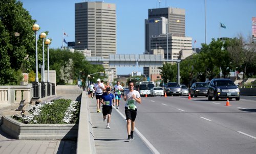 Runners on Main Street. Participants in the Manitoba Marathon, Sunday, June 21, 2015. (TREVOR HAGAN/WINNIPEG FREE PRESS)