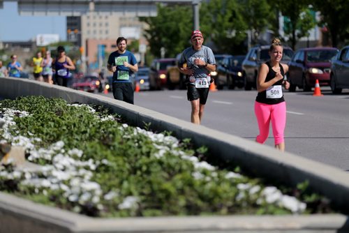 Runners on Main Street. Participants in the Manitoba Marathon, Sunday, June 21, 2015. (TREVOR HAGAN/WINNIPEG FREE PRESS)