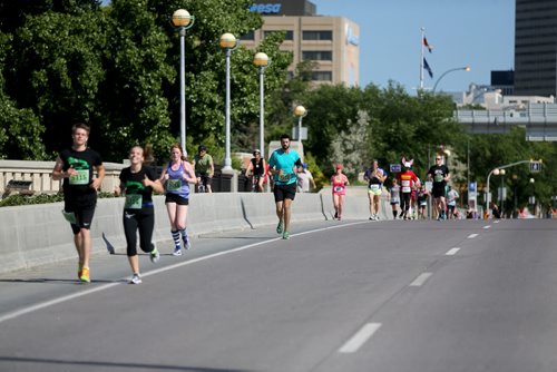 Runners on Main Street. Participants in the Manitoba Marathon, Sunday, June 21, 2015. (TREVOR HAGAN/WINNIPEG FREE PRESS)