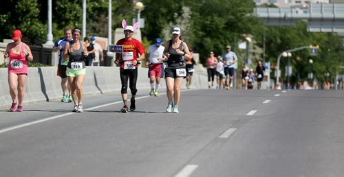 Runners on Main Street. Participants in the Manitoba Marathon, Sunday, June 21, 2015. (TREVOR HAGAN/WINNIPEG FREE PRESS)