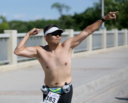 Erid Mendoza on St.Mary's road. Participants in the Manitoba Marathon, Sunday, June 21, 2015. (TREVOR HAGAN/WINNIPEG FREE PRESS)