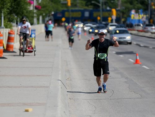 On St.Mary's road. Participants in the Manitoba Marathon, Sunday, June 21, 2015. (TREVOR HAGAN/WINNIPEG FREE PRESS)