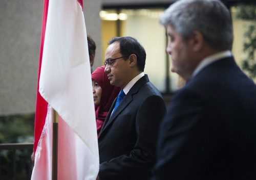 Indonesian ambassador Teuku Faizasyah takes part in a symbolic flag-raising ceremony at the Royal Canadian Mint in Winnipeg on Monday, June 22, 2015.  The mint will now be making coins for Indonesia. Mikaela MacKenzie / Winnipeg Free Press