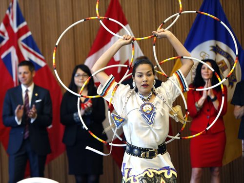 Hoop dancer Shanley Spence was one of the performers at City Hall Monday at Mayor Brian Bowman's announcement of the members on the Mayors Indigenous Advisory Circle to advise on policies the City of Winnipeg can implement to continue to build awareness, bridges and understanding between the Aboriginal and non-Aboriginal community. In back from left is Mayor Brian Bowman, Dee Thomas-Hart and  Kimberley Puhach.Aldo Santin story. Wayne Glowacki / Winnipeg Free Press June 22  2015