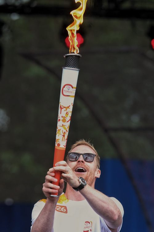 Olympian Jon Montgomery with the Pan Am Torch at The Forks preparing to light the cauldron during a Torch Relay ceremony Monday afternoon.  150622 June 22, 2015 MIKE DEAL / WINNIPEG FREE PRESS