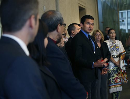 In centre, Wab Kinew glances at Mayor Brian Bowman at far left, Wab will be one of the members of the Mayors Indigenous Advisory Circle to advise on policies the City of Winnipeg can implement to continue to build awareness, bridges and understanding between the Aboriginal and non-Aboriginal community.    Aldo Santin story. Wayne Glowacki / Winnipeg Free Press June 22  2015