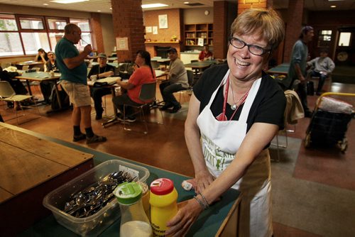 Lynda Trono, community minister, at West Broadway Community Ministry won the "get your hands dirty award" from the Provincial Council of Women. The award comes with an apron the says "Not afraid to get my hands dirty." 150622 June 22, 2015 MIKE DEAL / WINNIPEG FREE PRESS