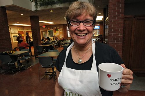 Lynda Trono, community minister, at West Broadway Community Ministry won the "get your hands dirty award" from the Provincial Council of Women. The award comes with an apron the says "Not afraid to get my hands dirty." 150622 June 22, 2015 MIKE DEAL / WINNIPEG FREE PRESS