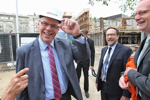 Manitoba Premier Greg Selinger (left) and Sherman Kreiner (centre), UofW Vice-President Student Life and the UofW Managing Director of the University of Winnipeg Community Renewal Corporation (UWCRC) and area MLA Rob Altemeyer (right) at the construction site of the new UWinnipeg Commons apartment complex. The 14 story building will house students, families and individuals downtown and will open in the summer of 2016. 150622 June 22, 2015 MIKE DEAL / WINNIPEG FREE PRESS