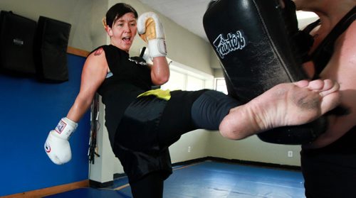 TRAINING BASKET : Trisha Sammons, a two-time Canadian Muay Thai champion trains Monday at Winnipeg's Women's KickBoxing. See Scott Billeck's story. June 22, 2015 - (Phil Hossack / Winnipeg Free Press)