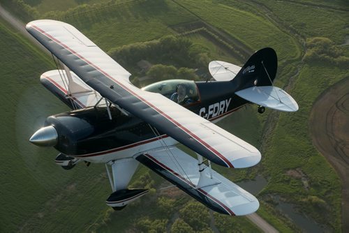 Pilot Luke Penner flies the Pitts S2B aerobatic biplane over Steinbach. Harv's Air Pilot Training offers rides in the Pitts for $250 a demonstration ride. The trip can include loops, rolls, hammerheads, barrel rolls and vertical rolls among other aerobatic maneuvers.  June 11, 2015 - MELISSA TAIT / WINNIPEG FREE PRESS