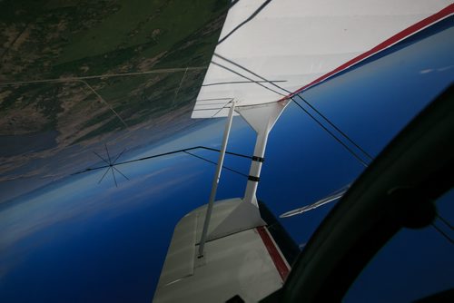View from the canopy while flying inverted in the Pitts S2B aerobatic biplane over St. Andrews. The black wire attached to the wing struts is a sighting device, which helps the pilot align the plane during intense aerobatic manoeuvres. Harv's Air Pilot Training offers rides in the Pitts S2B aerobatic biplane for $250 a demonstration ride. The trip can include loops, rolls, hammerheads, barrel rolls and vertical rolls among other aerobatic maneuvers.  June 04, 2015 - MELISSA TAIT / WINNIPEG FREE PRESS