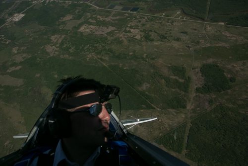 Pilot Luke Penner sights the horizon while flying into a loop aboard the Pitts S2B aerobatic biplane.Harv's Air Pilot Training offers rides in the Pitts S2B aerobatic biplane for $250 a demonstration ride. The trip can include loops, rolls, hammerheads, barrel rolls and vertical rolls among other aerobatic maneuvers.  June 04, 2015 - MELISSA TAIT / WINNIPEG FREE PRESS