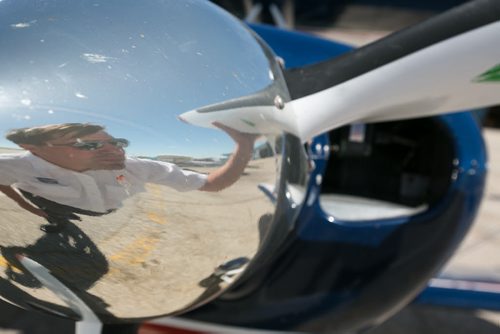 Pilot Luke Penner reflected in the propellor of the Harv's Air Pitts S2B aerobatic biplane. Harv's Air Pilot Training offers rides in the Pitts for $250 a demonstration ride. The trip can include loops, rolls, hammerheads, barrel rolls and vertical rolls among other aerobatic maneuvers.  June 04, 2015 - MELISSA TAIT / WINNIPEG FREE PRESS