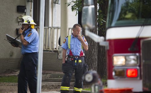 Firefighters outside a house fire at 349 Bertrand St. in Winnipeg on Tuesday, June 23, 2015. Mikaela MacKenzie / Winnipeg Free Press