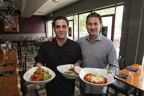 Nicolino's owner Nick Zifarelli (right) and head chef Fabrizio Rossi (left) with dishes (l-r) Casarecce with wild mushrooms and lamb ragu, Polpette with sundried olives and spicy peperoncini, and Lasagna all'emiliana.  150623 June 23, 2015 MIKE DEAL / WINNIPEG FREE PRESS