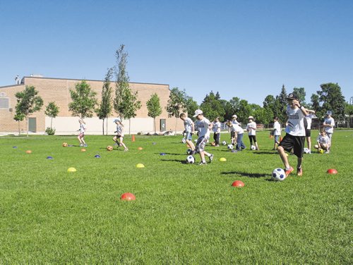 Canstar Community News June 18, 2015 - A group of Grade 4 students run through a set of drills as part of the River East-Transcona School Division's German Bilingual Program soccer camp. (SHELDON BIRNIE/CANSTAR COMMUNITY NEWS/THE HERALD)