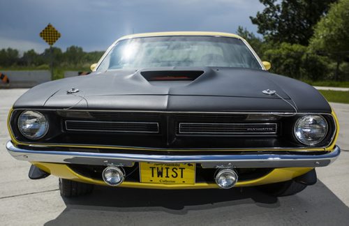 Rhonda Reyher shows off her 1970 AAR 'Cuda, which she believes to be one of the only ones in Manitoba, in Winnipeg on Tuesday, June 23, 2015. Mikaela MacKenzie / Winnipeg Free Press