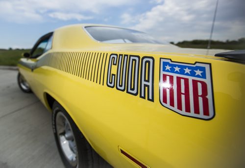 Rhonda Reyher shows off her 1970 AAR 'Cuda, which she believes to be one of the only ones in Manitoba, in Winnipeg on Tuesday, June 23, 2015. Mikaela MacKenzie / Winnipeg Free Press