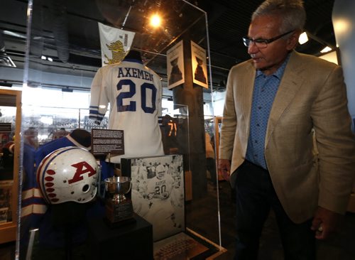 Former Winnipeg Blue Bomber punter Bob Cameron by a display of his 1977 Acadia Axemen jersey and helmet part of the Gridiron Greats  exhibit presented by the Winnipeg Football Club that opened Tuesday at the Manitoba Sports Hall of Fame Gallery, Sport for Life Centre at 145 Pacific Avenue. The special limited-time exhibit features Manitoba's outstanding football history.  Scott Billeck story Wayne Glowacki / Winnipeg Free Press June 23 2015