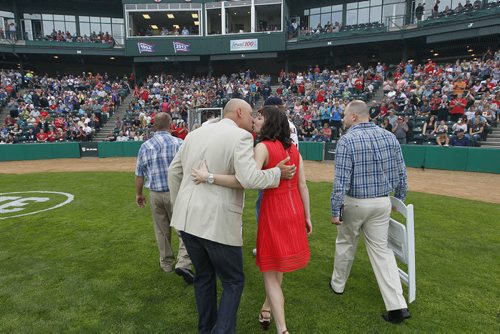 June 23, 2015 - 150623  - Ace Walker and his wife sneak a kiss after a celebration to retire his jersey prior to the Goldeye's game against the Gary Southshore Railcats in Winnipeg Tuesday, June 23, 2015. John Woods / Winnipeg Free Press