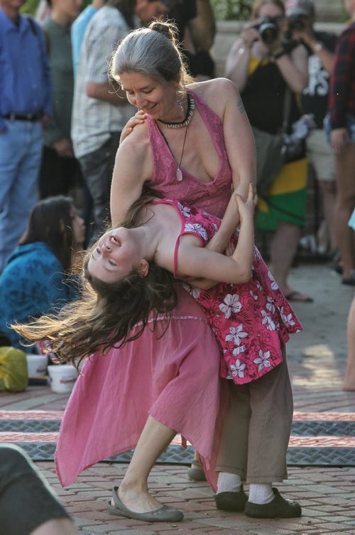 Jolie Lesperance dances with Ezra Schafer, 7, in front of the Festival Stage at The Forks during the United Way 50th Anniversary concert, One Night For Winnipeg.  150624 June 24, 2015 MIKE DEAL / WINNIPEG FREE PRESS