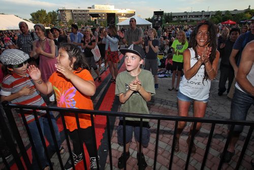 The crowd clap hands for Mitch Dorge's "united audience drumming" performance between sets while on the Festival Stage at The Forks during the United Way 50th Anniversary concert, One Night For Winnipeg.  150624 June 24, 2015 MIKE DEAL / WINNIPEG FREE PRESS