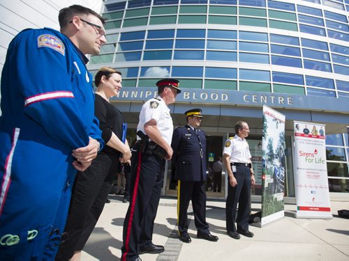 First responders listen to speeches before giving blood as part of the Sirens for Life initiative at the Canadian Blood Services in Winnipeg on Thursday, June 25, 2015. Mikaela MacKenzie / Winnipeg Free Press