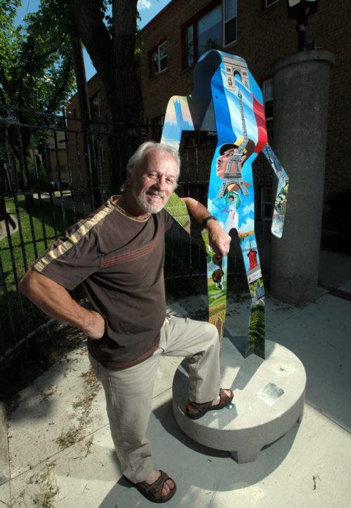 Hubert Theroux, the artist behind the street art piece about France poses with his piece. Corydon Avenue Biz has a new street art initiative called the Colours of Corydon which involves eight huge abstract metal figures that represent eight different countries. They will all be positioned at various spots on Corydon. See Kevin Prokosh story. June 25, 2015 - (Phil Hossack / Winnipeg Free Press)
