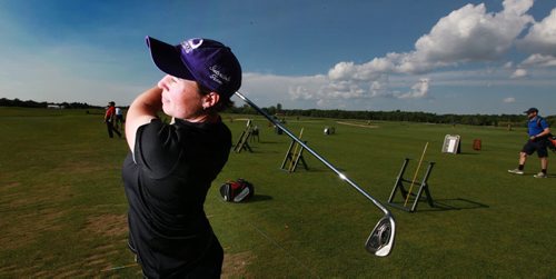 Jill Hardy keeps an eye on the long ball while working out on the range at Southwood Golf Club Thursday. See Tim Canpbell's story.  June 25, 2015 - (Phil Hossack / Winnipeg Free Press)