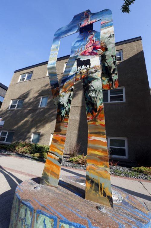 Artist Michel Saint Hilaire's "Spain" one of eight abstract metal figures that represent eight different countries that are part of the Corydon Avenue Biz's  new street art initiative called the Colours of Corydon. This art piece is on Corydon Ave. near Lilac St. Kevin Prokosh story. Wayne Glowacki / Winnipeg Free Press June 26  2015