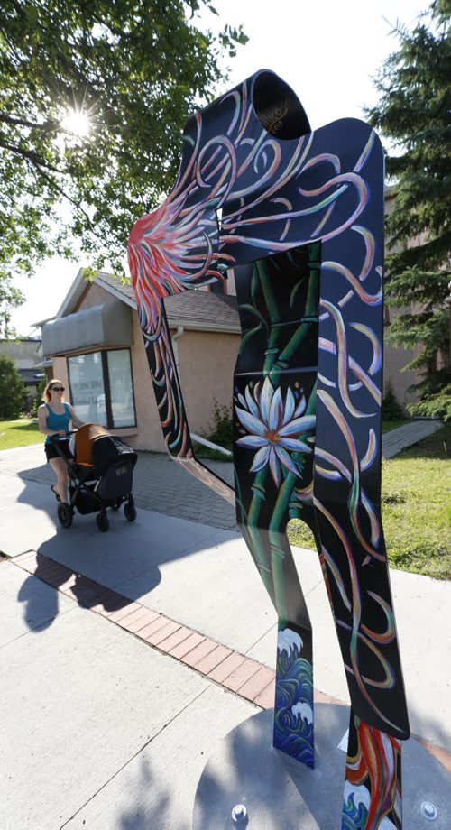 Artists Angela Lillico and Genevie Henderson's street art titled "Japan" one of eight abstract metal figures that represent eight different countries that are part of the Corydon Avenue Biz's  new street art initiative called the Colours of Corydon. This art piece is on Corydon Ave. near Lilac St.  Kevin Prokosh story. Wayne Glowacki / Winnipeg Free Press June 26  2015