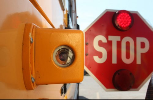 Maurice Gregoire, president and lead product designer at Teknisult set up a pilot project placing cameras on sides of school buses to catch drivers passing when stopping guard is out.  Photo of one of two cameras on side of bus. See Jessica Botelho-Urbanski story.  June 26,, 2015 Ruth Bonneville / Winnipeg Free Press