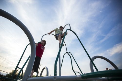 Brothers Karsen (left) and Zachary Prynne play grounders with a group of friends in River Heights in Winnipeg on Friday, June 26, 2015. Mikaela MacKenzie / Winnipeg Free Press