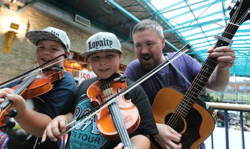 Uptown feature on local group called - Double the Trouble, which is a father and twin sons group here in Winnipeg.  Father, Rob Wrigley, who's been in bands around town for years. plays with his 12-year-old sons, Luc (centre)  and Aidan, both fiddlers, Metis folk music and are launching a CD at the Park Theatre on Thursday night,   For July 2 edition of Uptown.  June 27,, 2015 Ruth Bonneville / Winnipeg Free Press