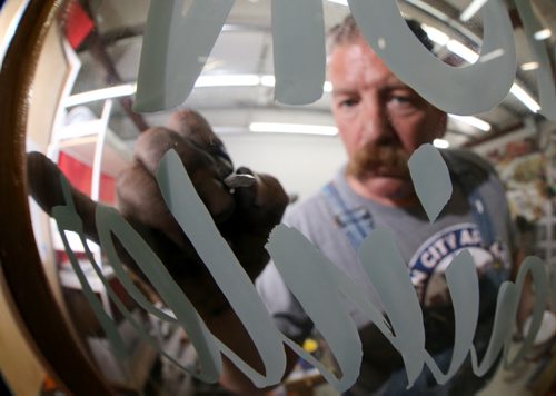 Mike Meyer was brought in to instruct a sign painting workshop at Signmeister, Saturday, June 27, 2015. The art of hand sign painting has been making a resurgence after nearly becoming obsolete due to computers and vinyl. (TREVOR HAGAN/WINNIPEG FREE PRESS)