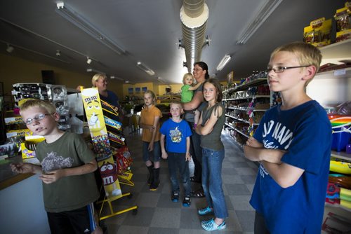 Residents gather in the general store after a severe storm in Roseisle, Manitoba damaged houses, cars, and crops and cut power on Saturday, June 27, 2015.   Mikaela MacKenzie / Winnipeg Free Press