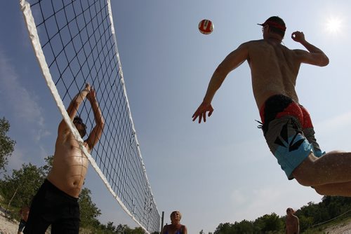 June 28, 2015 - 150628  -  Stan Korol goes for the spike as Steve Bakaluk blocks at Grand Beach Sunday, June 28, 2015. John Woods / Winnipeg Free Press