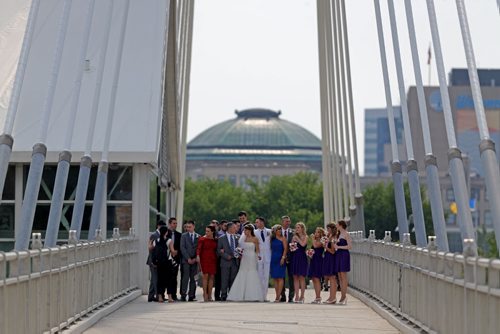 Ilana and Ilya Noureev pose for wedding photos on the Esplanade Riel, Sunday, June 28, 2015. (TREVOR HAGAN/WINNIPEG FREE PRESS)