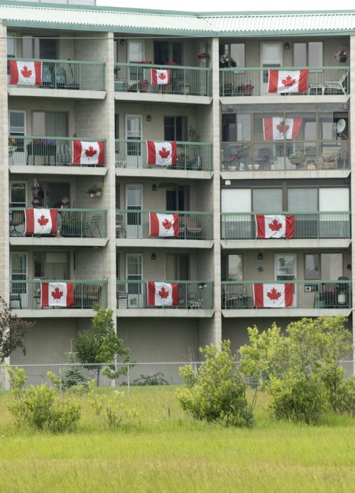 DAVID LIPNOWSKI / WINNIPEG FREE PRESS (June 29, 2015)  Almost every apartment at Agape Villa (395 Beaverhill Blvd) has a Canadian flag on their balcony. The social committee received a grant for the flags.