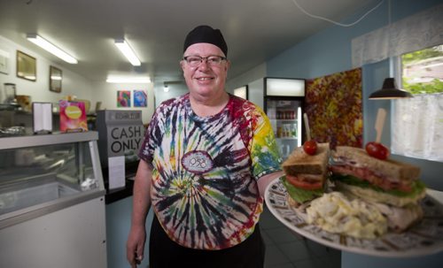 Ross Jeffers, owner of Cafe 1958, shows off the clubhouse sandwich in his retro-styled cafe in Wolseley on Monday, June 29, 2015.   Mikaela MacKenzie / Winnipeg Free Press