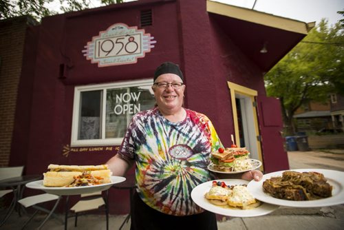 Ross Jeffers, owner of Cafe 1958, shows off his West Broadway cheezsteak, eggs benny, meatloaf, and clubhouse sandwich at his retro-styled cafe in Wolseley on Monday, June 29, 2015.   Mikaela MacKenzie / Winnipeg Free Press