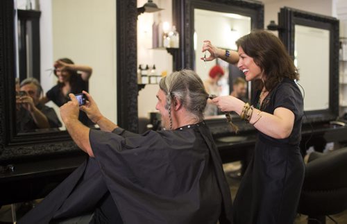Boris Minkevich, photojournalist at the Winnipeg Free Press, gets his  hair cut to make a wig for a cancer patient at Berns & Black salon on Monday, June 29, 2015.   Mikaela MacKenzie / Winnipeg Free Press