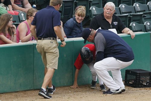 June 29, 2015 - 150629  -   Winnipeg Goldeyes manager Rick Forney rushed over to assist a ball boy who was hit by a foul ball during play against the Sioux City Explorers in Winnipeg Monday, June 29, 2015.  John Woods / Winnipeg Free Press